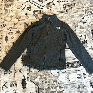 Extra small Grey North face light weight jacket is in a good condition but worn.